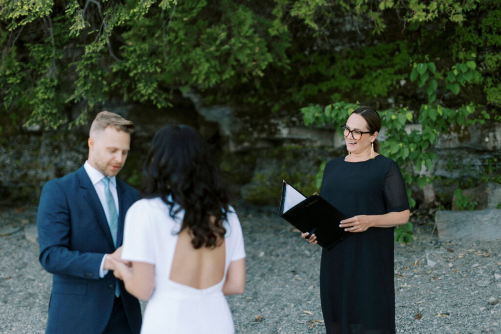 Ontario Wedding Officiant, True North Ceremonies officiating a wedding ceremony at Constance Bay, captured by Scott Wilson Photography.