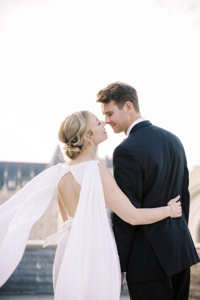 Elegant black tie English garden wedding at the National Arts Centre, captured by Emily Michelson Photography, showcasing lush florals and timeless design.