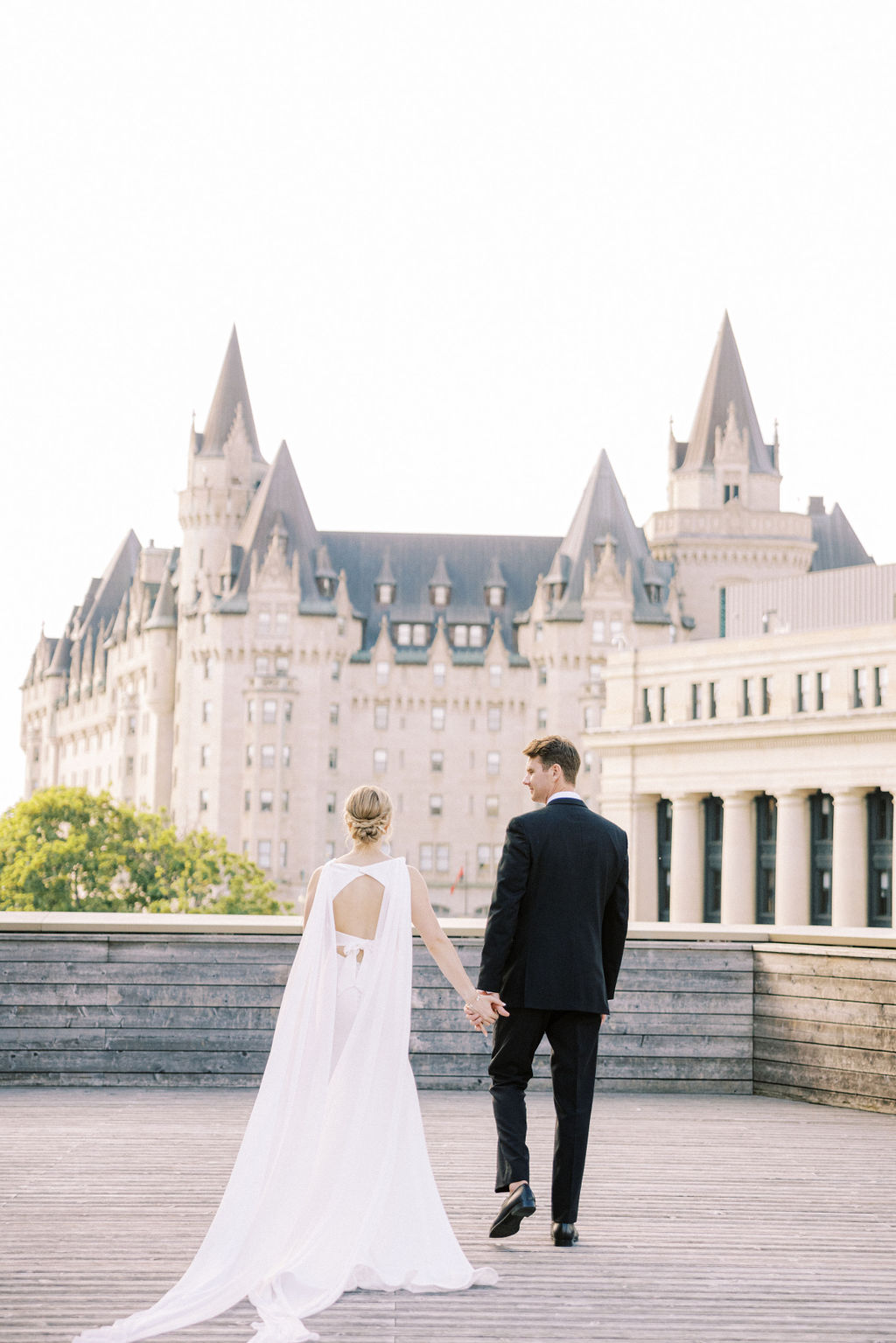 Elegant black tie English garden wedding at the National Arts Centre, captured by Emily Michelson Photography, showcasing lush florals and timeless design.