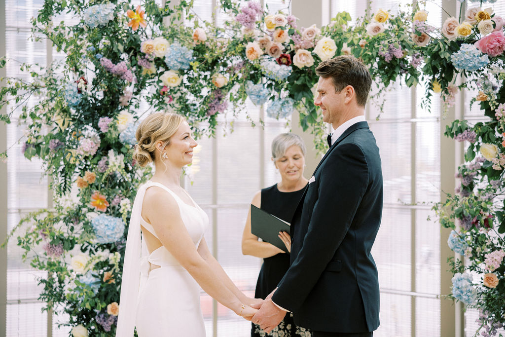 Elegant black tie English garden wedding at the National Arts Centre, captured by Emily Michelson Photography, showcasing lush florals and timeless design.