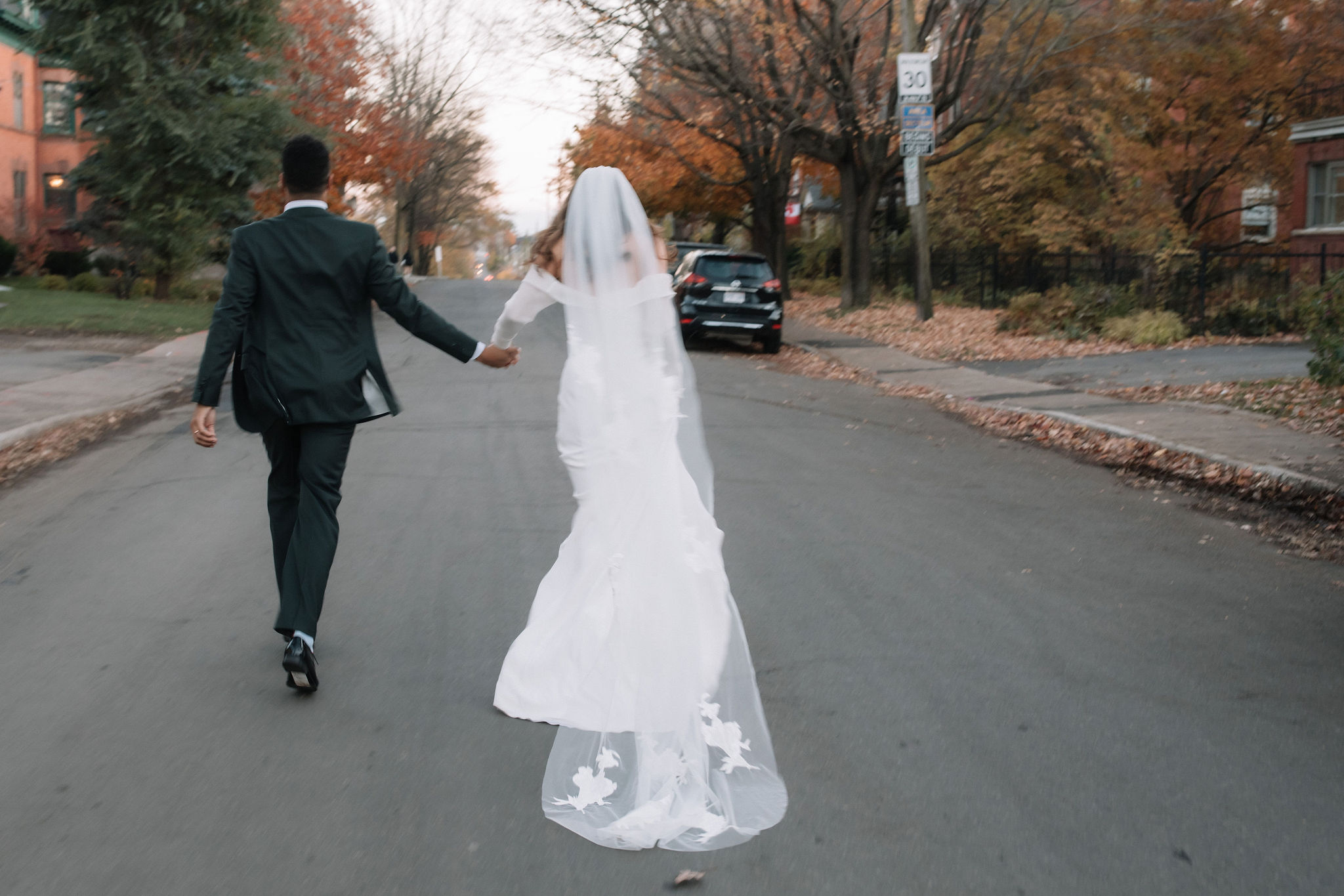 A newlywed couple at AllSaints Wedding Venue in Ottawa, captured by Danielle Meredith Photography, embracing in a heartfelt moment filled with sentimental wedding traditions.